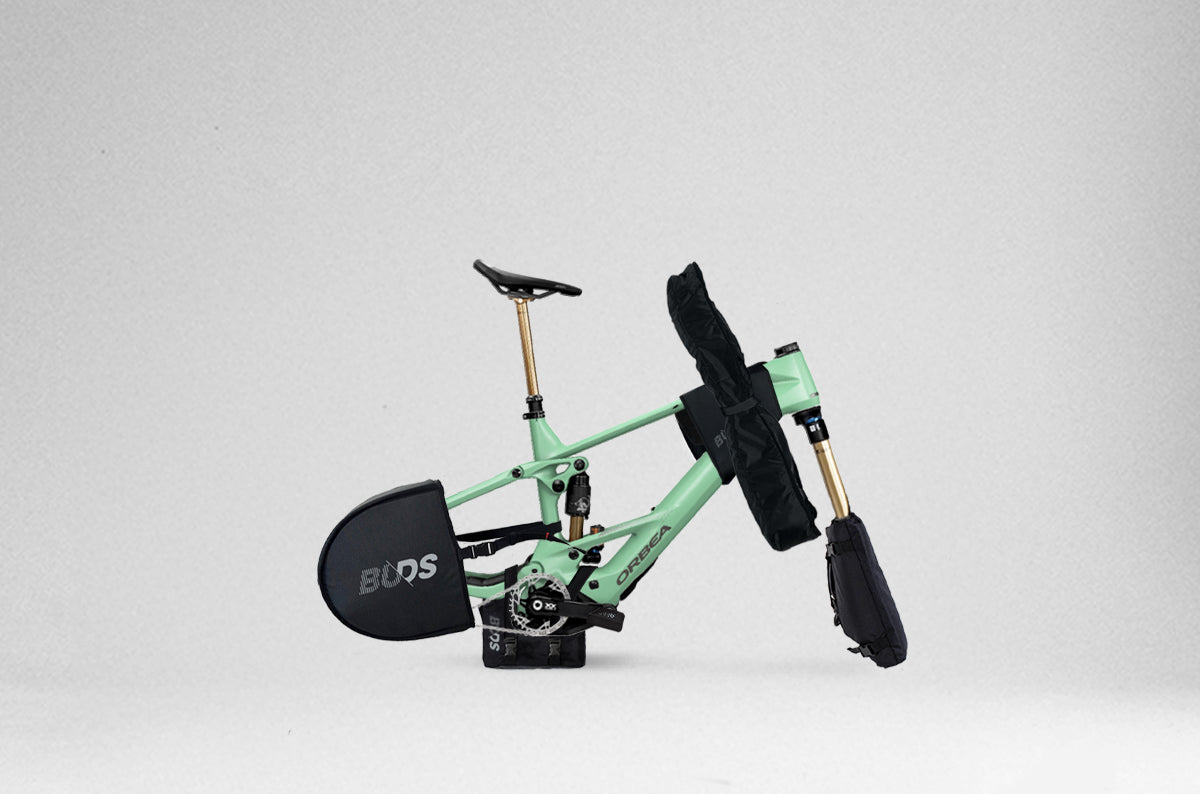 Rollbag Pro protection kit fitted on a mountain bike: fork, frame, drivetrain, rear derailleur and handlebar protectors